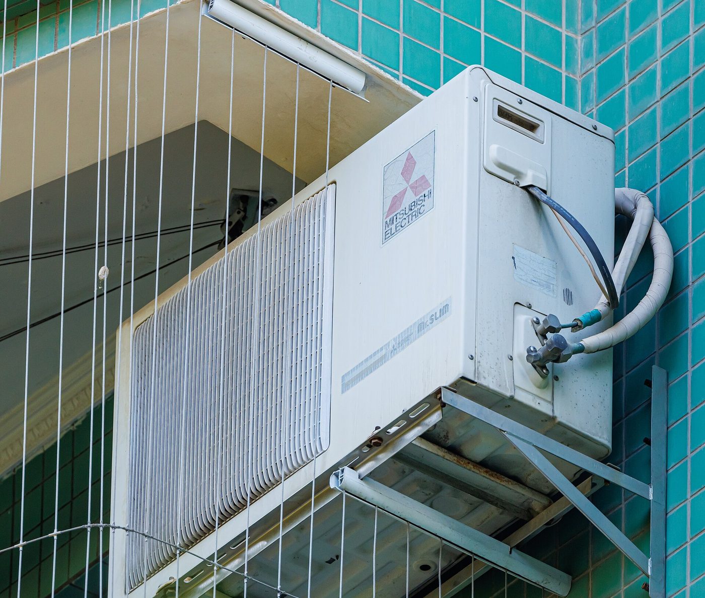 Mitsubishi Electric Mr. Slim outdoor mini split unit mounted on a wall bracket